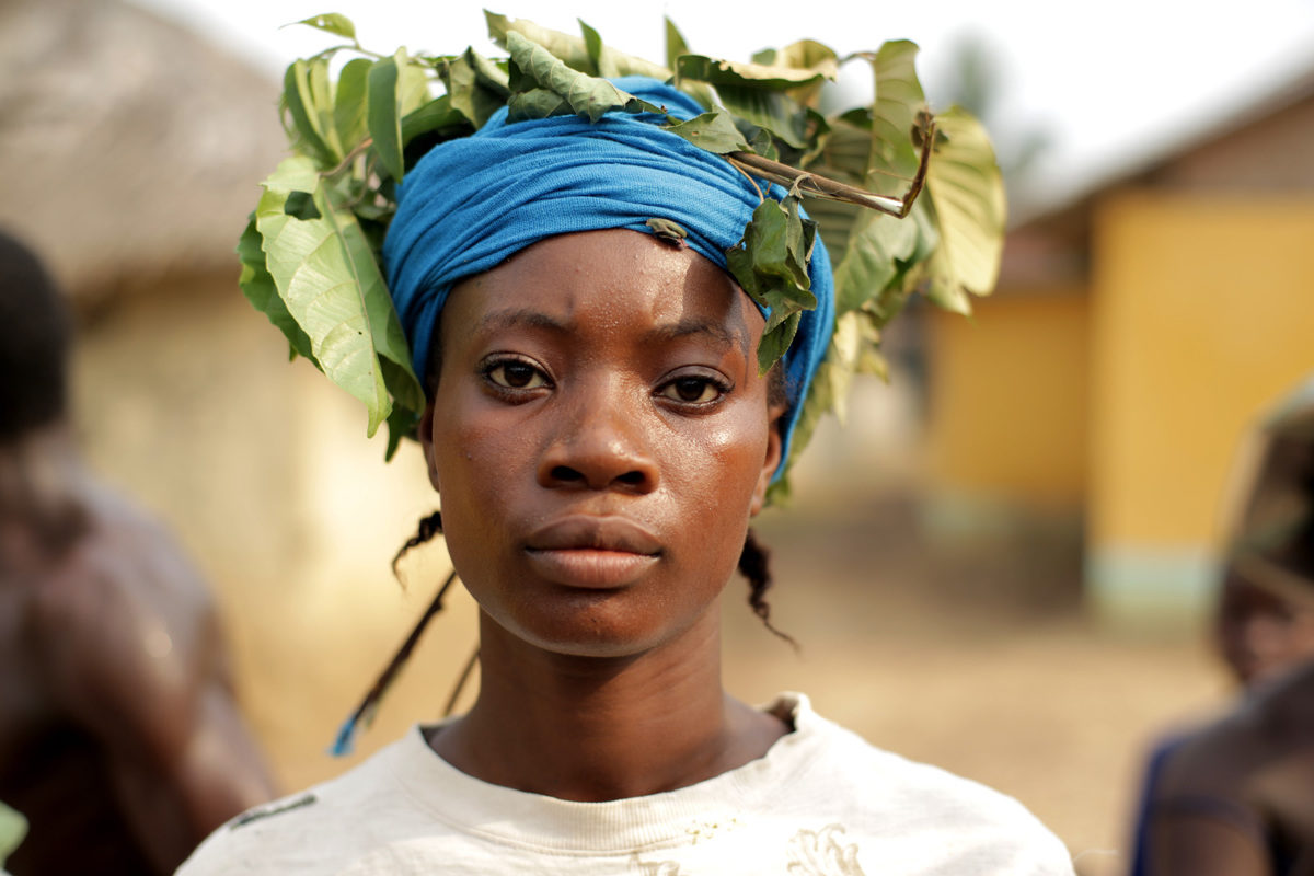 An African woman with a crown of leaves on her head
