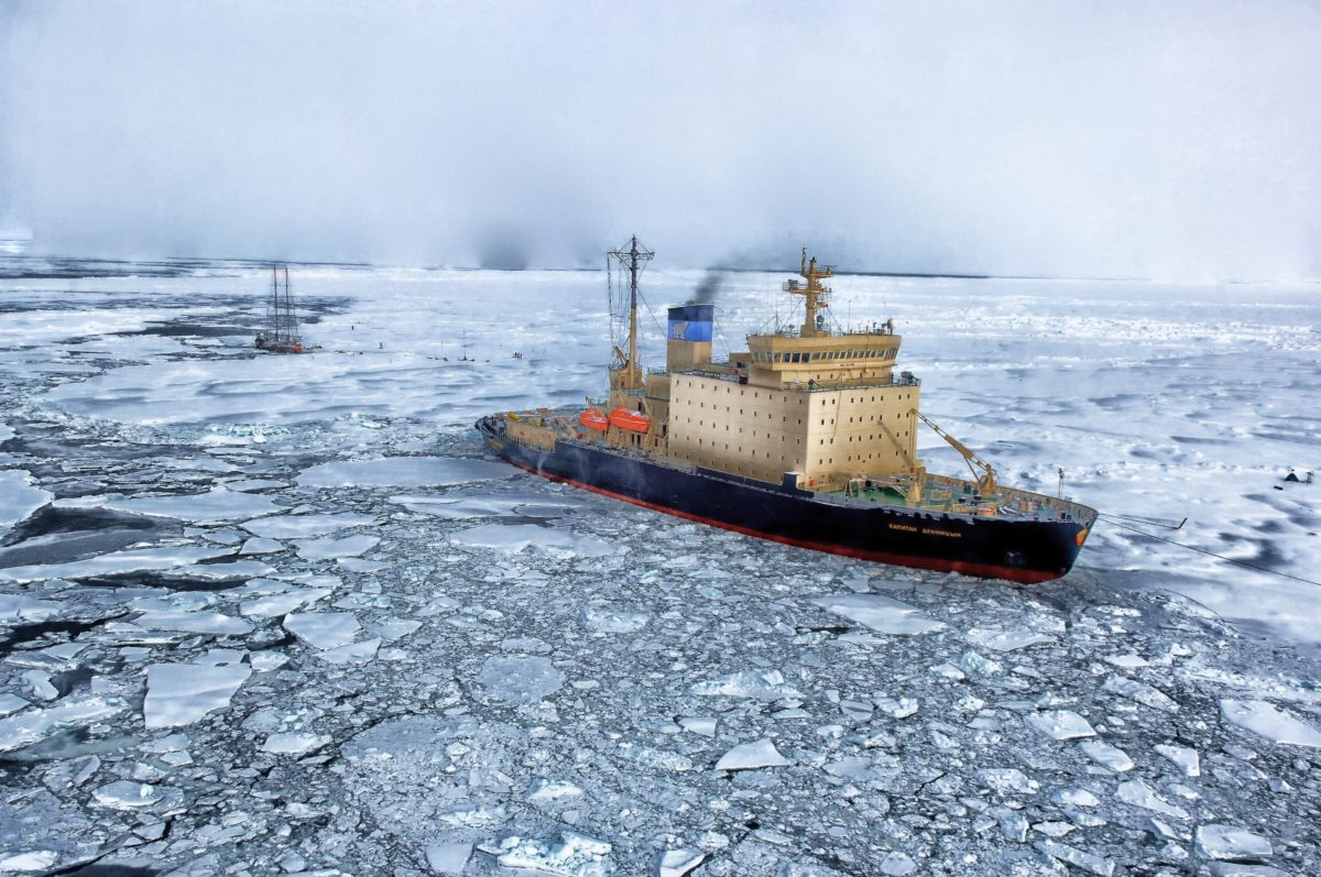 Ship sailing through broken up ice