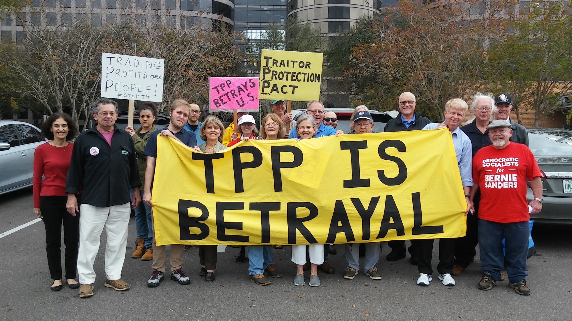 Friends of the Earth members and allies protest TPP signing in Tampa