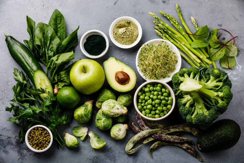 Assorted vegetables sitting on a countertop