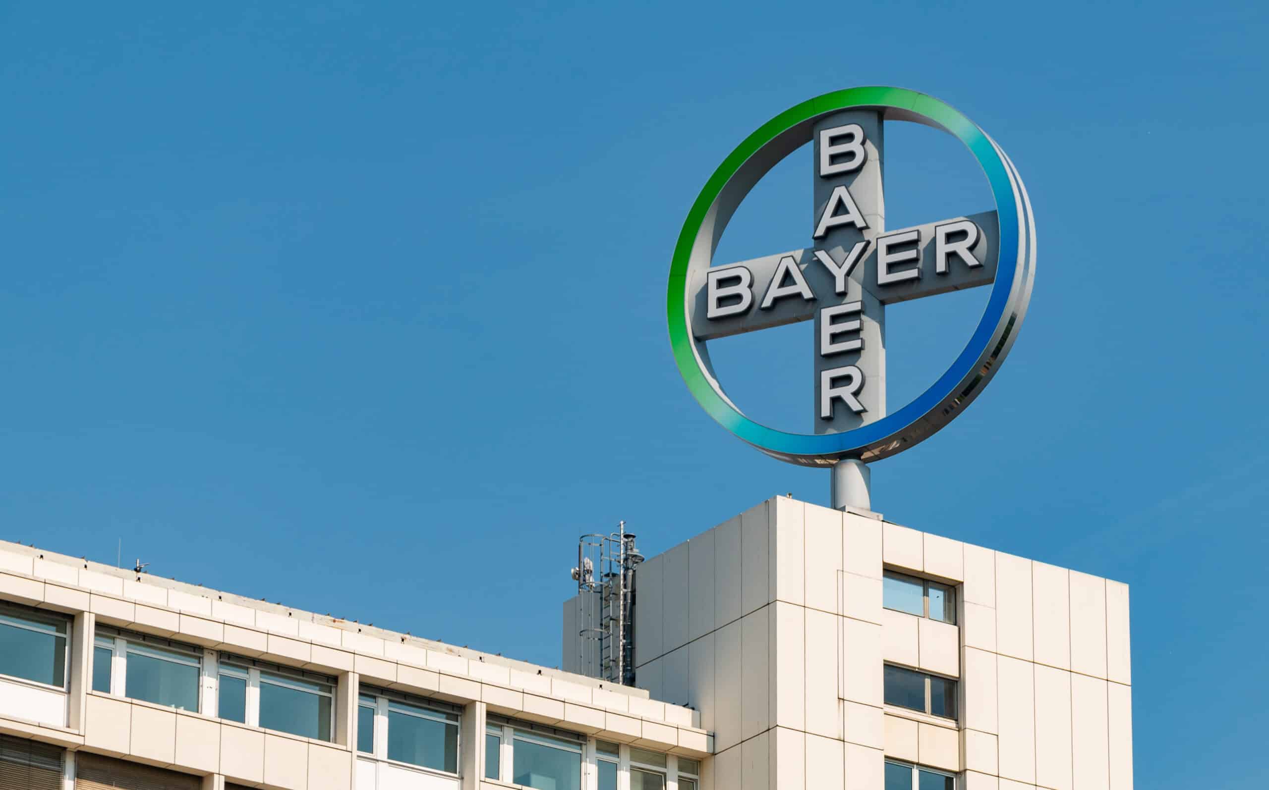May contain a Bayer logo on a building against a blue sky.