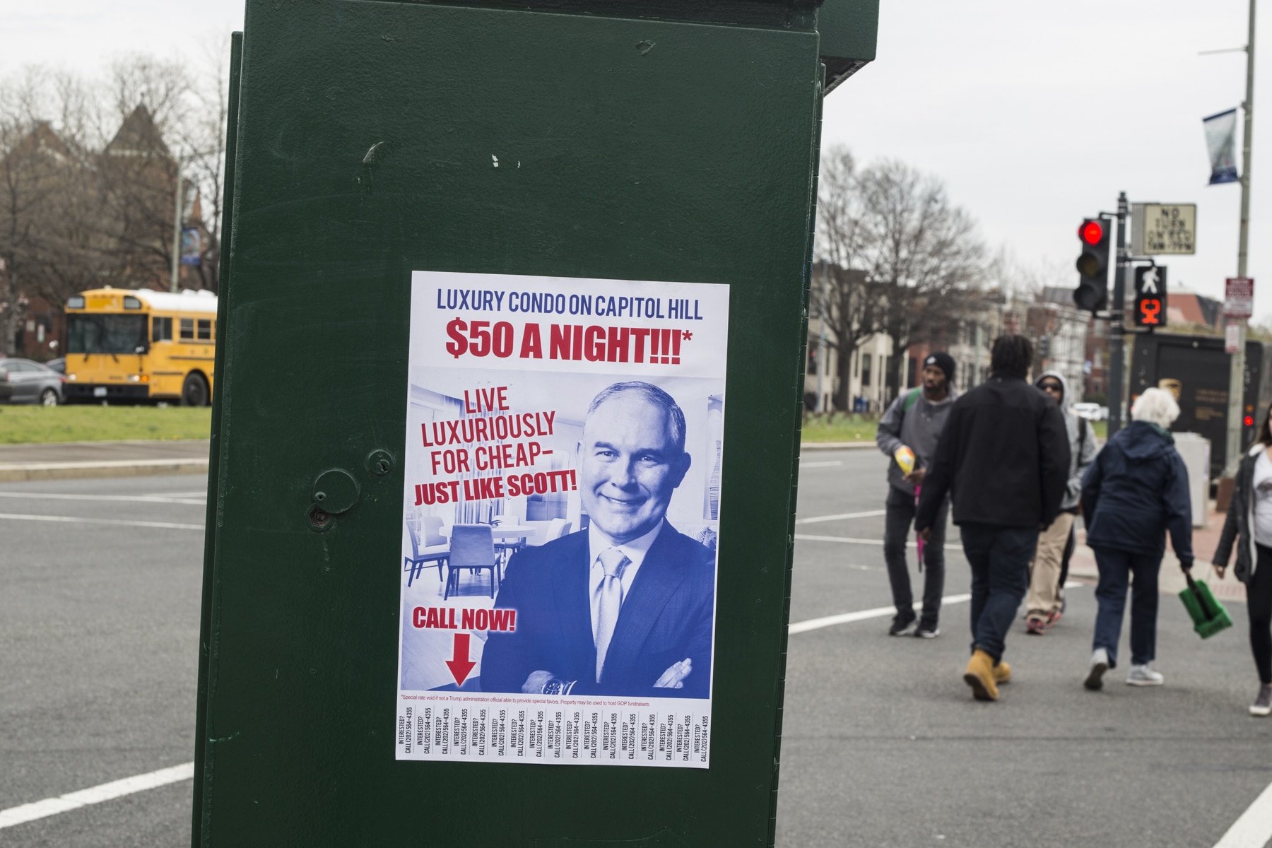Sign on an electrical box criticizing Scott Pruitt receiving discounted rent on a condo