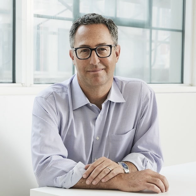 May contain one person wearing glasses and a collared shirt.