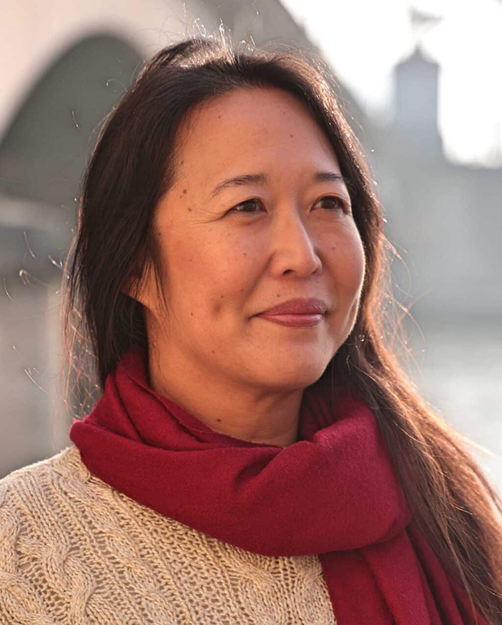 May contain one person wearing a red scarf and sweater.