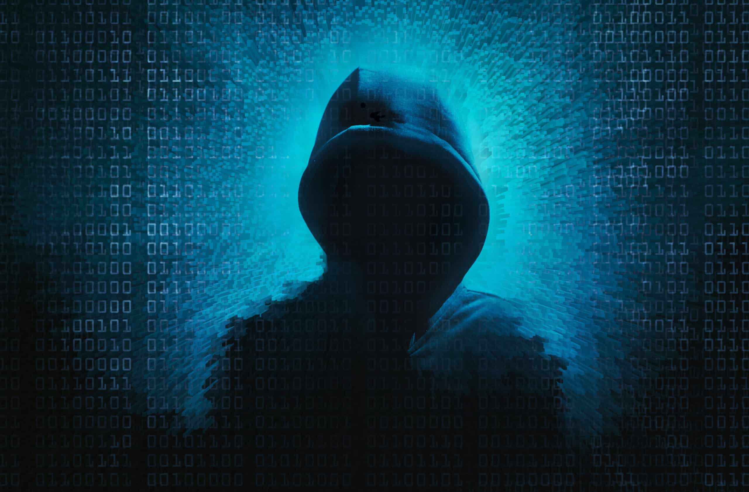 May contain a person in a hooded sweatshirt against a binary code background.