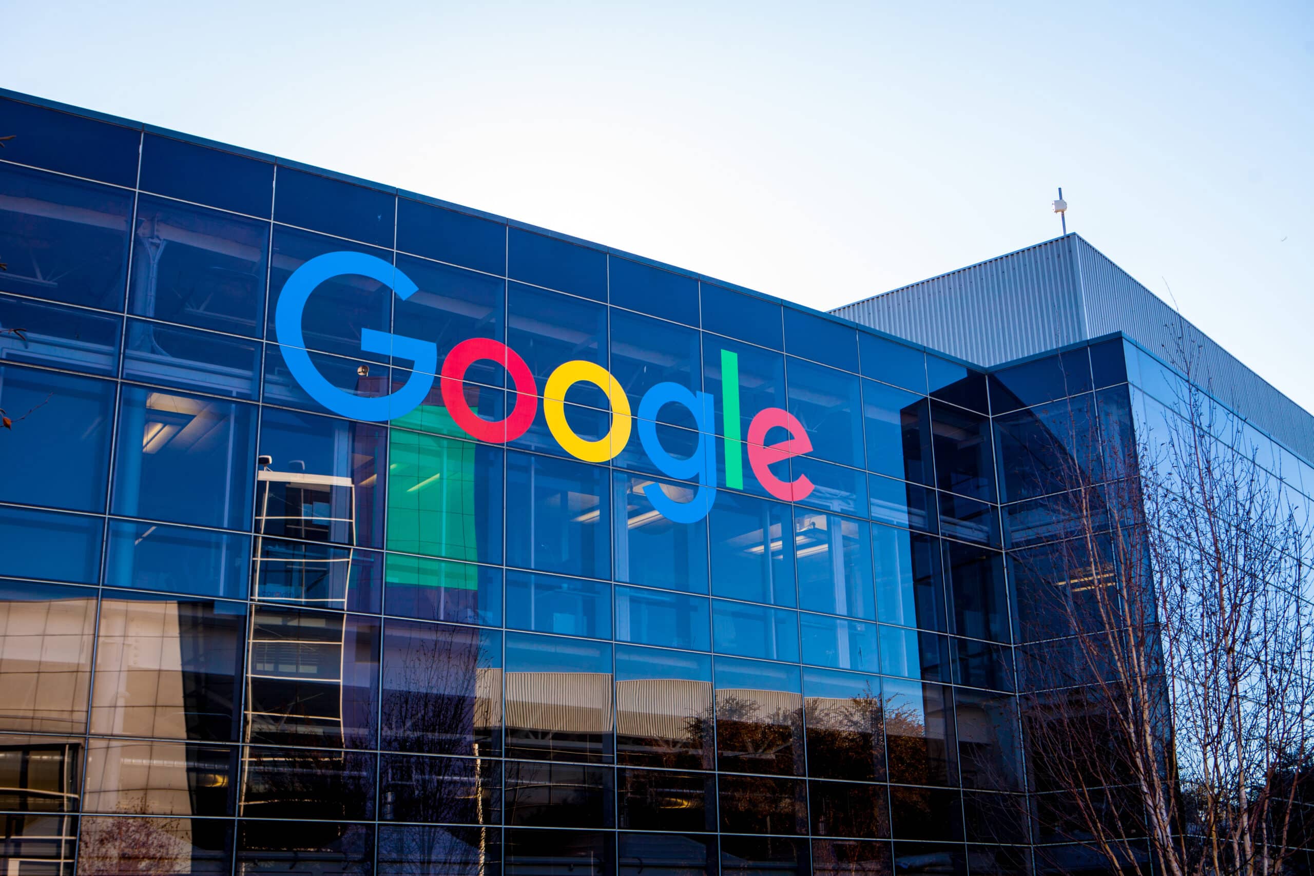May contain Google logo on a glass building.