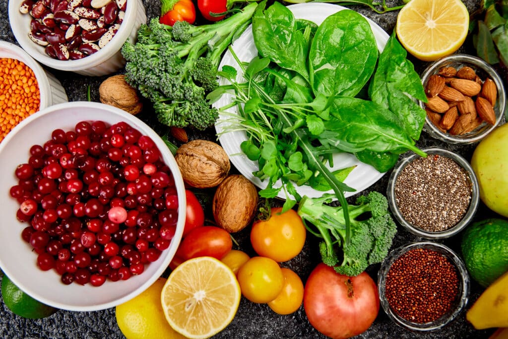 May contain food items including cranberries, beans, lentils, broccoli, spinach, tomatoes, lemons, walnuts, almonds, chia seeds, quinoa, apples, and limes.