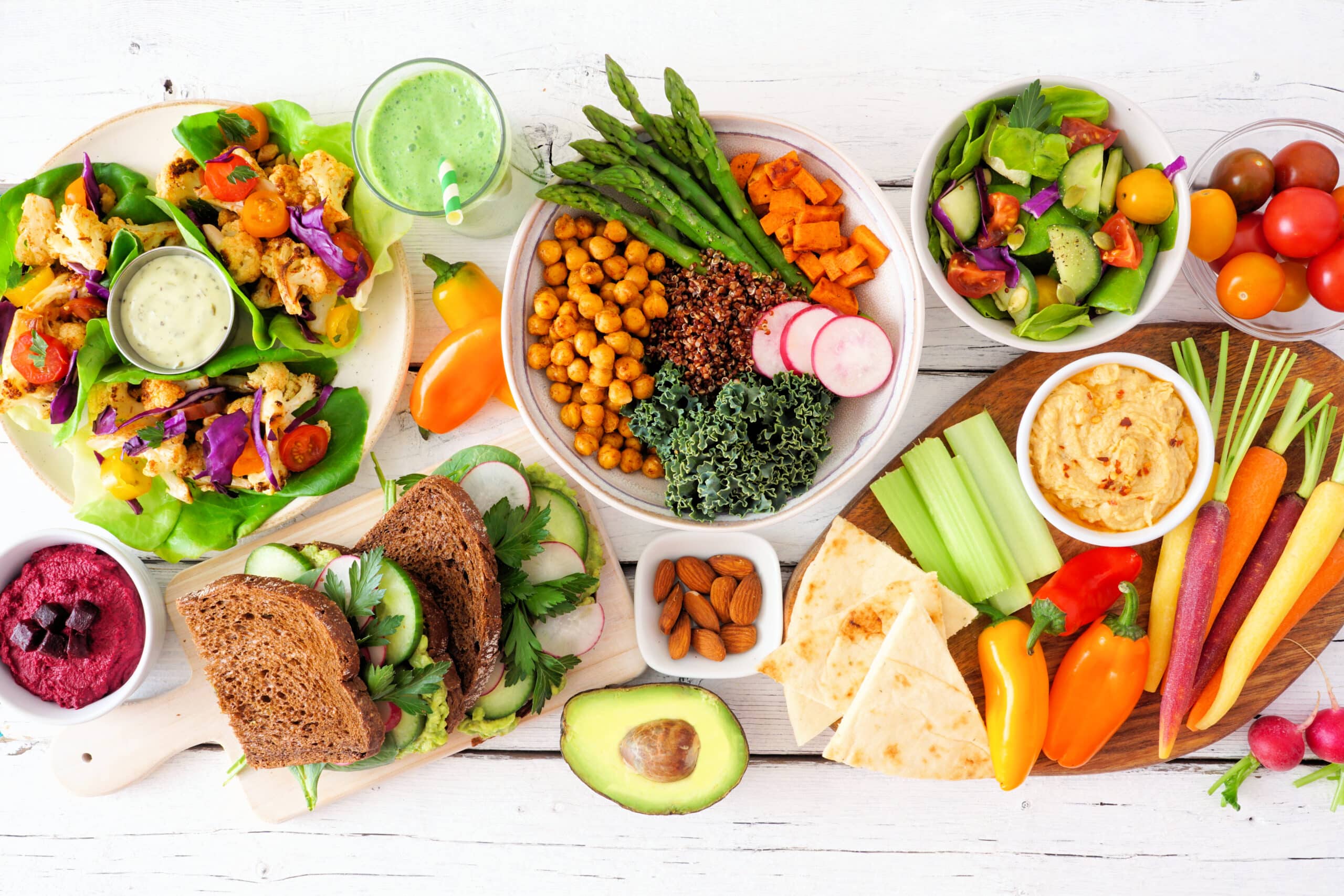 May contain a variety of healthy foods including dips, vegetables, and bread.