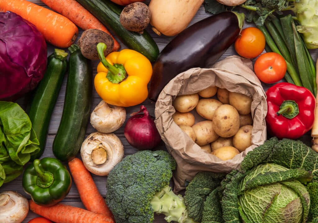 May contain a variety of fresh vegetables, including potatoes, carrots, and broccoli.
