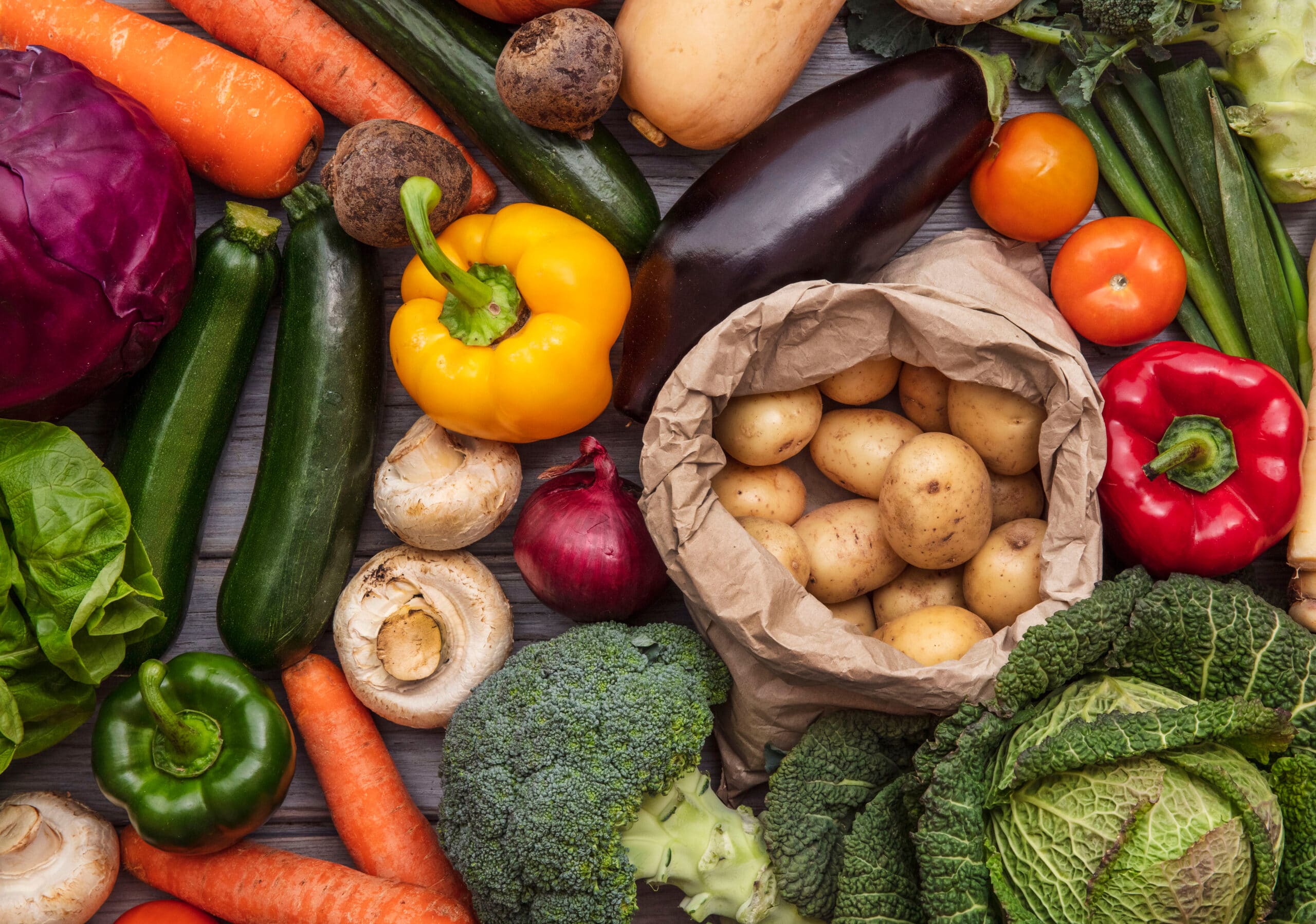 May contain a variety of fresh vegetables, including potatoes, carrots, and broccoli.
