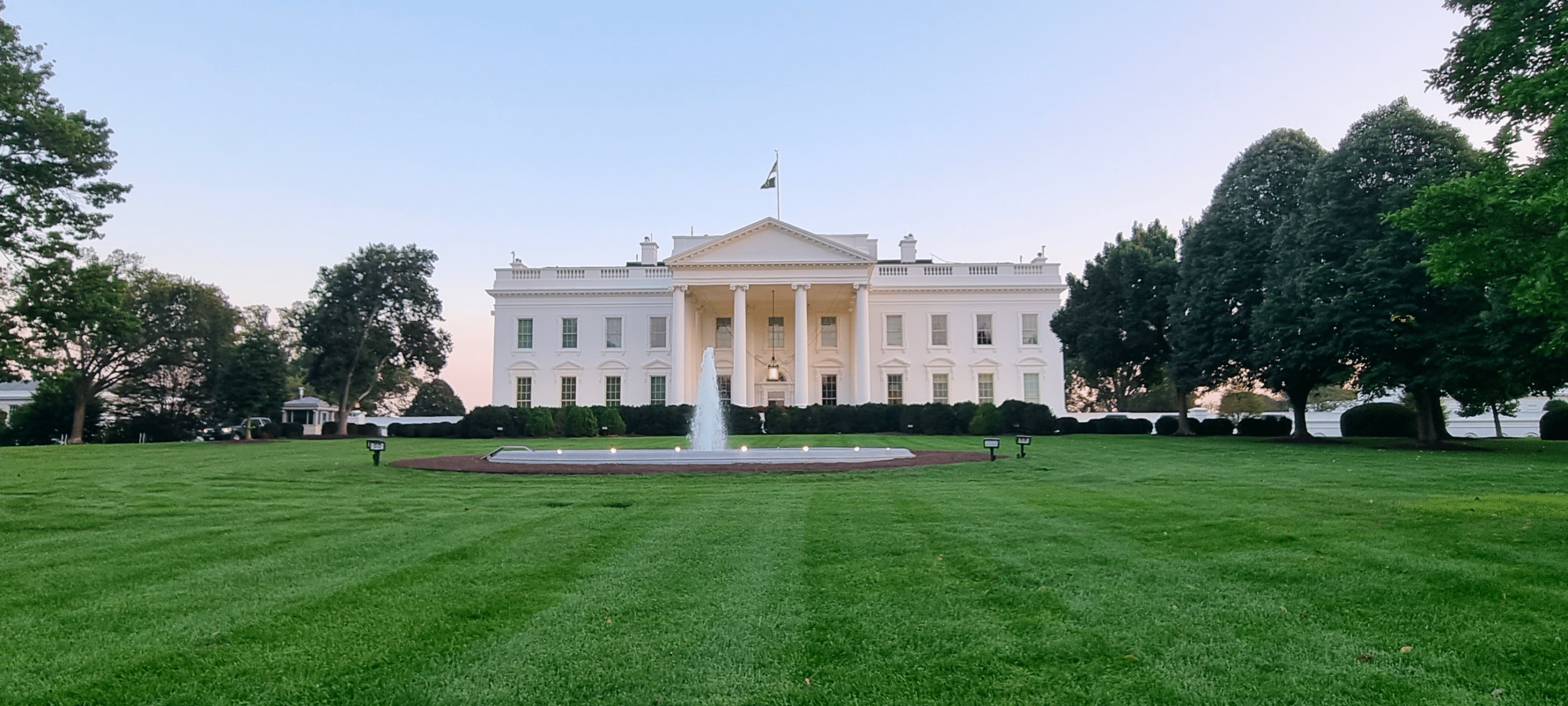 May contain the White House with a fountain and trees.