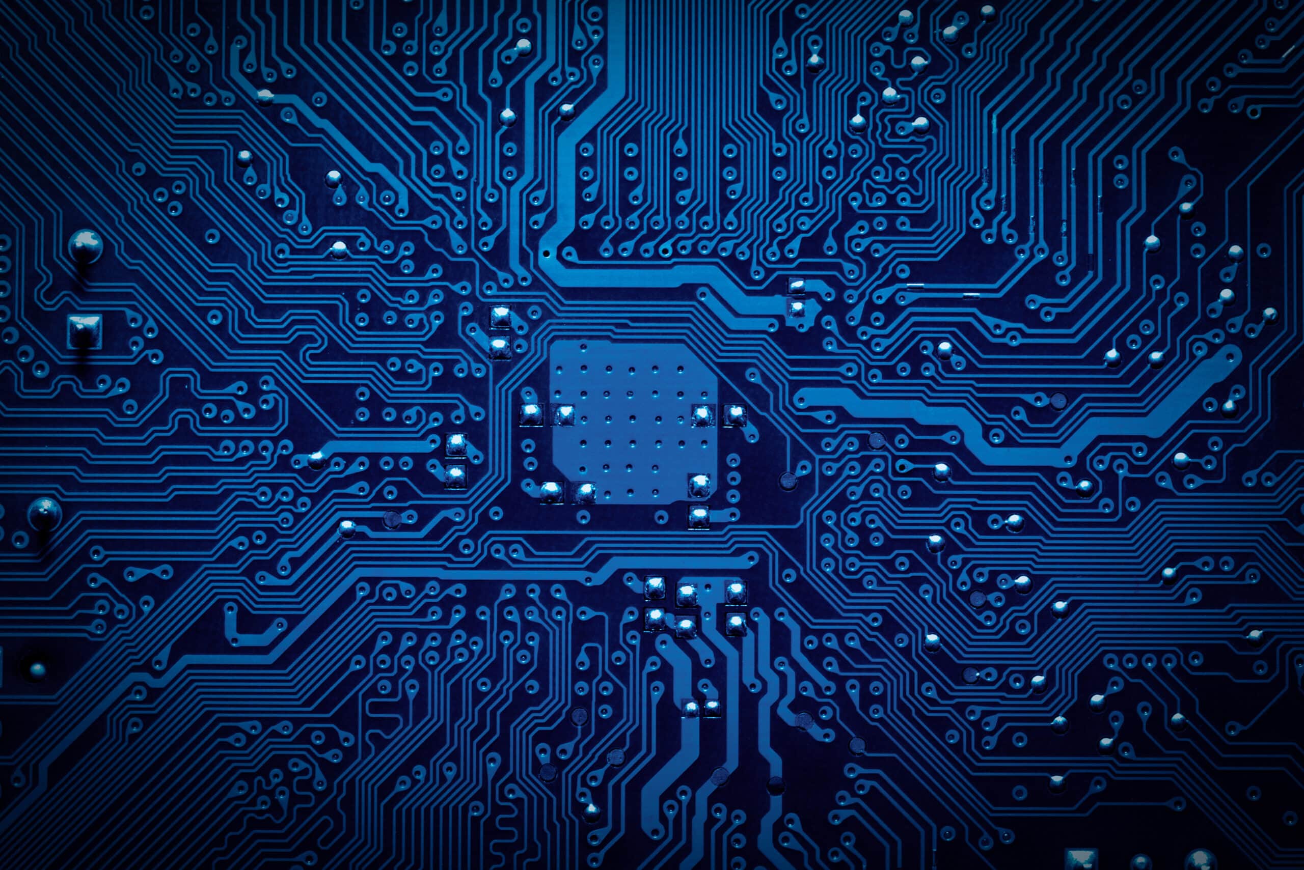 May contain a close-up of a blue computer circuit board.
